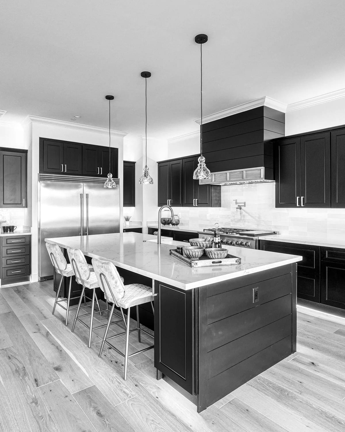 Kitchen interior with fitted cabinetry and a stone counter